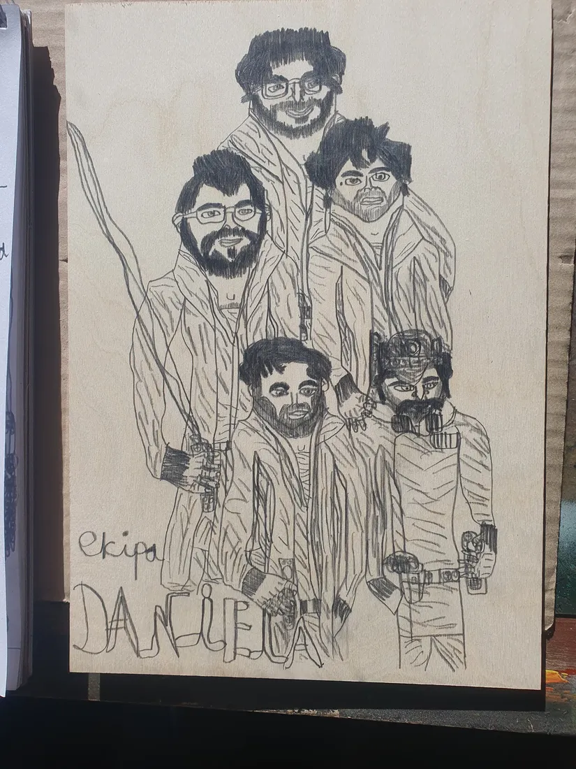 The board with five figures in dark, burnt outlines